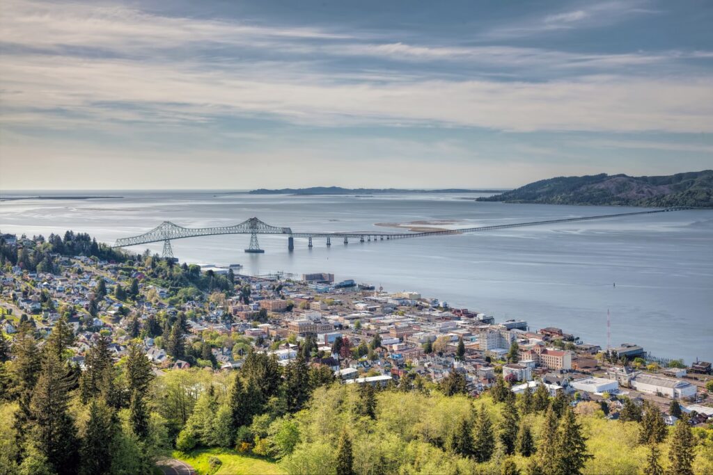 Aerial view of Astoria, Oregon, with the Astoria-Megler Bridge spanning the Columbia River.